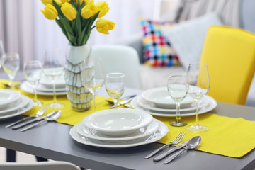 Table served with dishes, close up