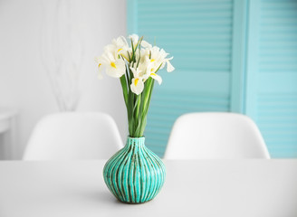 Fresh white irises on dinning table, indoors