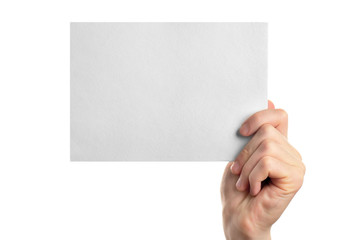 Obraz premium Male hand holding clean sheet of paper, isolated on white