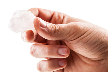 Holding a rose quartz piece