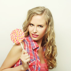 blond  girl with  lolipop