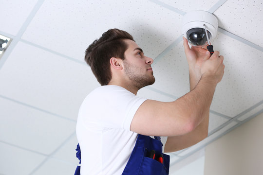 Professional CCTV technician working.