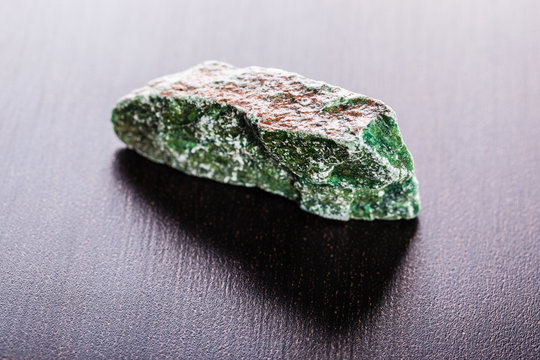 fuchsite piece on wood