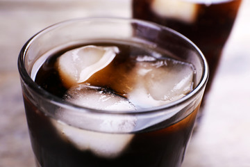 Glass of soda water with ice, close up