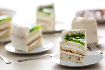 Piece of lime cake on table