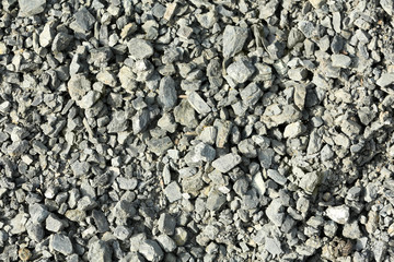 Crushed grey stones texture background