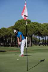 Obraz premium golf player hitting shot at sunny day