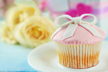 Happy Mother's day concept. Cupcake on a plate.