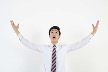 Happy energetic businessman with his arms raised
