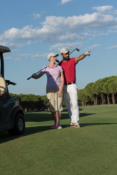portrait of golfers couple on golf course