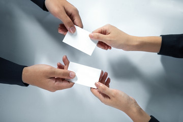 Obraz premium business executive exchanging business card