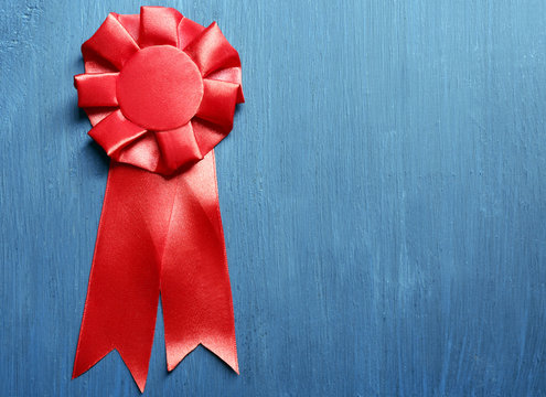 Award ribbon on wooden background