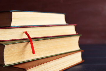 Pile of books on wooden background