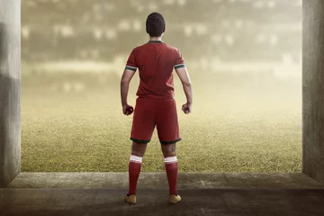 Gordijnen Back view of asian football player standing © Leo Lintang