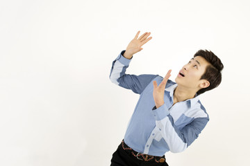 Young man protecting himself with hands up in defensive position