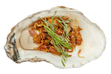 A fresh oyster topped with vegetable and sauce, the tasty Asian