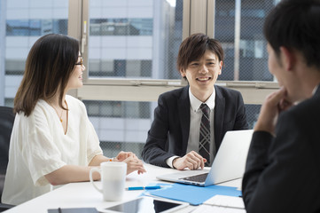 Three businessmen have a meeting in the office