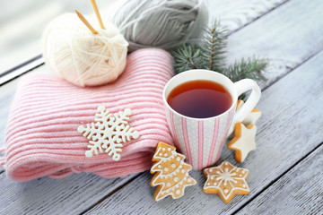 Fototapeta na wymiar Beautiful winter composition with cup of hot drink, on wooden table