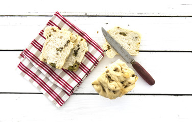 Freash Olive Bread cut on a rustic wooden table