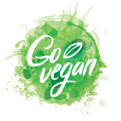 Words GO VEGAN in simple and cute frame with green branches and leaves. Vectorized watercolor drawing.