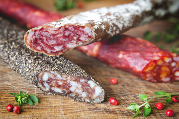 Three types of spanish sausages on wooden board