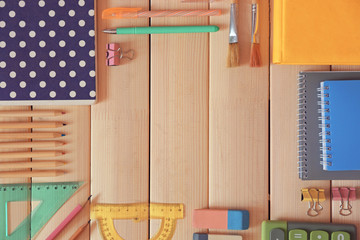 Flat lay of stationery on wooden background
