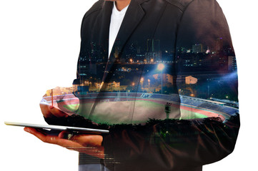 Double exposure of Businessman use Digital Tablet with Sport Sta