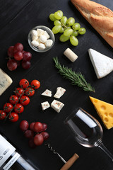 Wine, snacks and different various of cheese, flat lay