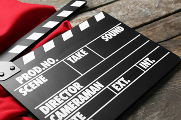 Movie clapper on wooden background