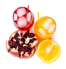 Iced pomegranate and orange drink with fresh fruits isolated on white