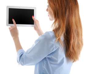 Young woman in blue shirt using tablet, isolated on white