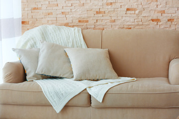 Stylish pillows on grey couch