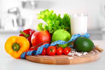 Set of fresh fruits and vegetables on wooden table closeup