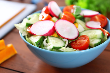 Vegetable salad on wooden table closeup