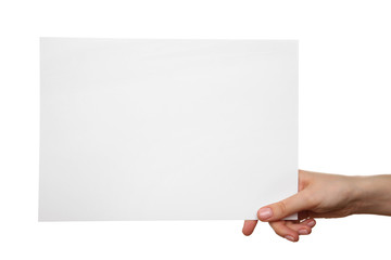 Female hand holding blank sheet of paper isolated on white