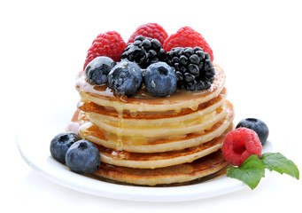 Healthy Breakfast.Pancakes with berries and honey.