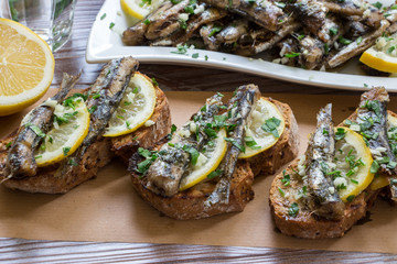 Snack from sandwiches with sardines.