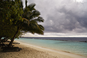 Beautiful island beach with sandspit at Maldives