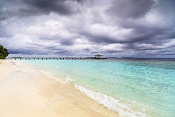 Beautiful island beach with sandspit at Maldives