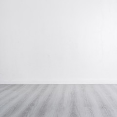 White wall with wooden gray floor and copyspace for your text, p