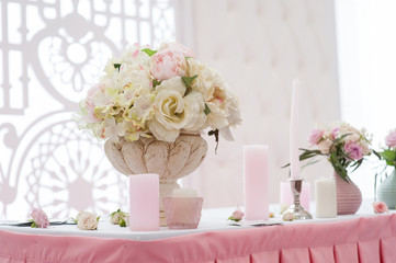 bouquet of flowers in a vase at the wedding table