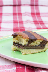 Triangular bitten chocolate cake