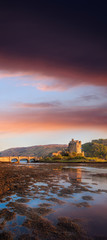 Fototapeta na wymiar Eilean Donan Castle against sunset in Highlands of Scotland
