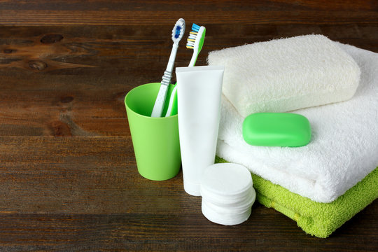personal hygiene products on brown wooden background