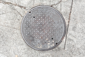 Rusty, grunge manhole cover