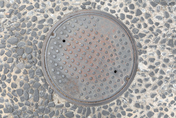 Rusty, grunge manhole cover