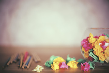 Crumpled paper and pencils