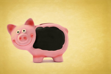 Pink piggy bank isolated on vintage background