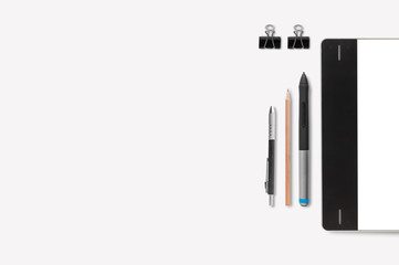 Graphic tablet with pencil on white background for text and back