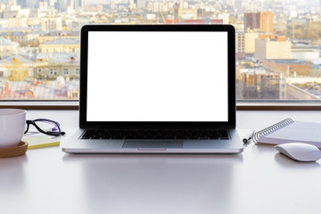 Blank white laptop screen closeup